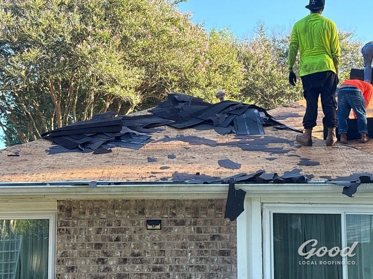 Good Local Roofing crew tearing off old shingles on a Richmond home.